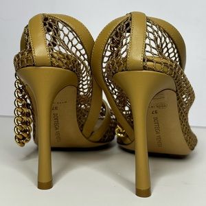 Bottega Veneta neutral, netted heels with gold anklet attached.